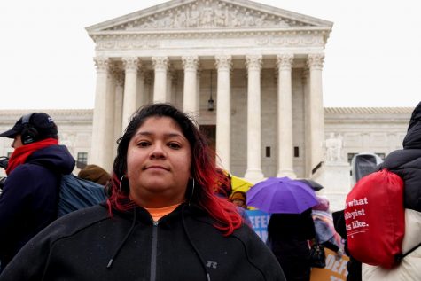 Angelica Villalobos, a DACA recipient from Oklahoma, stands outside the U.S. Supreme Court awaiting the start of arguments that could dictate the future of undocumented immigrants who came to the states as children. Addison Kliewer/Gaylord News.