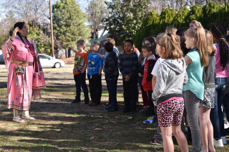 Tracey Satepauhoodle-Mikkanen, Executive Director of the Jacobson House, teaches students.