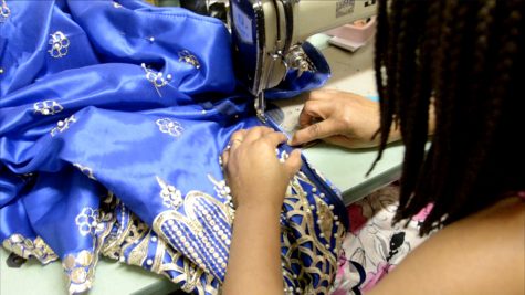 Betty is working on her latest project, a royal blue gown for a customer graduating from medical school. Photo by Rebecca Walters.