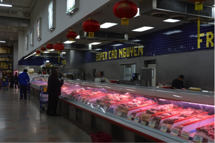 Super Cao Nguyen customers survey the food options that the market has to offer. Abby Green/News Crowd

