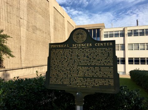 A plaque in front of the 50-year-old Physical Sciences Center at the University of Oklahoma.