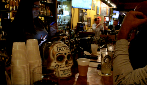 Waitress Lauren Todd serves margaritas to customers as they await the tequila dinner at Puebla Tacos y Tequileria. The dinner includes beer, tequila, a three-course meal and a tequila 101 course.