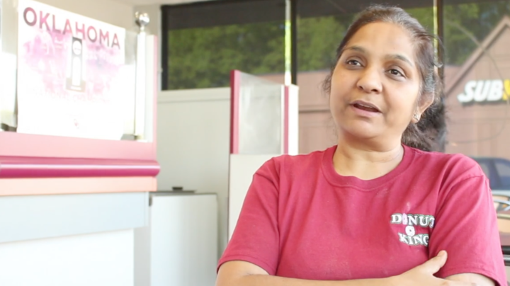 Donut King owner Dipti Patel talks to a customer in her shop on Nov. 17. Patel has owned the store since 1994. 