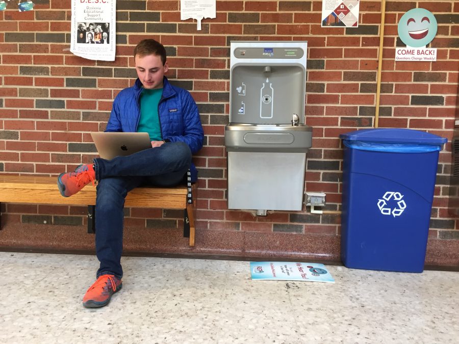 An OU student studies next to one of the six water refill stations in Dale Hall. 