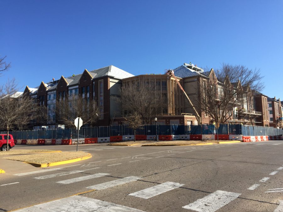 Construction workers reach the final stage in the development of Cross OU. The complex will contain a black box theatre, a coffee shop and multiple retail shops.