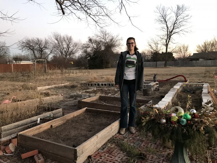 Elizabeth Guthrie stands amongst her raised garden beds in Newcastle.