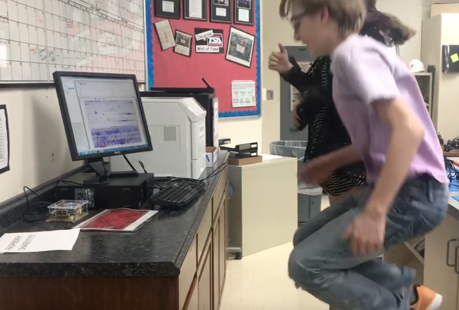 Cheyenne Middle School students Emmaline Ferguson and Austin Vinall demonstrate how the Raspberry Shake picks up data from students jumping on the ground.