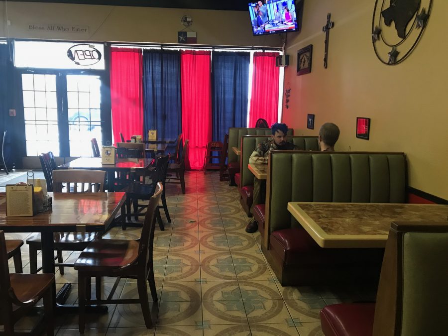 Two customers eat at the Campfire Grill on March 24 in Watauga, Texas.  