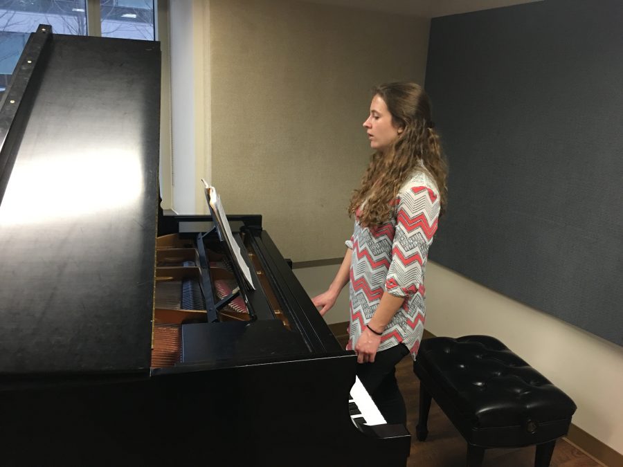 Music education sophomore Bryla Birdwell does voice exercises in Donald W. Reynolds Performing Arts Center. Birdwell pays over $250 a semester for instrumental accompaniment.