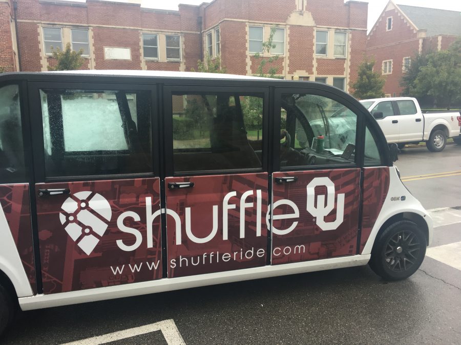 A driver parks a Shuffle vehicle by the University of Oklahoma student union. Shuffle is a new transportation service that allows students to pay $3 to ride to places on or near campus. 