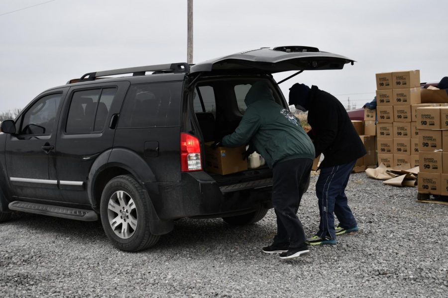 Oklahoma Kiowa Tribe volunteers load free food into a recipient’s car after severe weather conditions hit the state. (Photo courtesy the Kiowa Tribe)