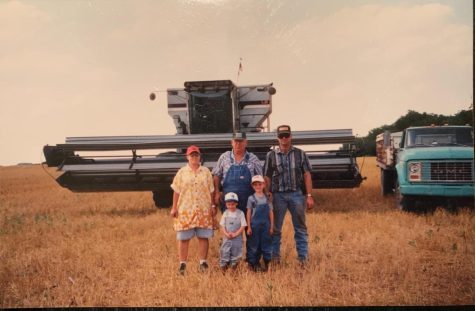 Three generations of the Heinrich Family in front of his diesel-powered combine. Gaylord News/Provided