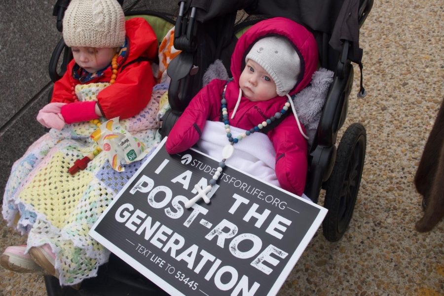A child holds a pro-life sign during a March for Life Demonstration this year in Washington, D.C. (Mikaela DeLeon/Gaylord News)