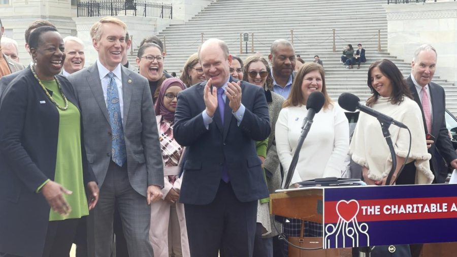 President and CEO of United Way Worldwide, Angela Williams, (left), Sen. James Lanford (center), and Delaware Sen. Chris Coons (right) celebrate the introduction of the “Charitable Act” outside the U.S. Capitol on March 1, 2023. (Gaylord News Photo / Gabriela Tumani