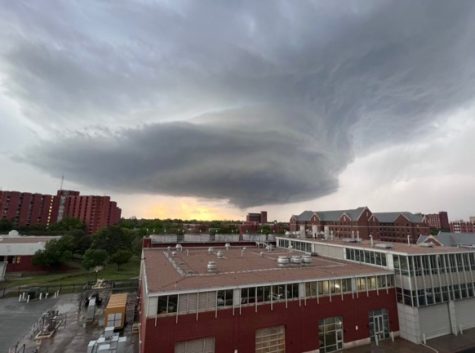 A funnel cloud hovers over OU’s campus. It never touched down on campus and provided evidence for a historical myth. (Gaylord News photo/Michael Buchanan)