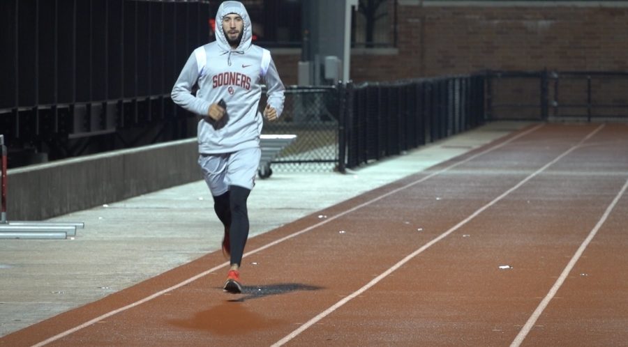 University of Oklahoma distance runner, Anass Mghari begins his daily practice at 8:45 p.m. on Friday, March 24, 2023. (Gaylord News photo/Kailey Carnine)
