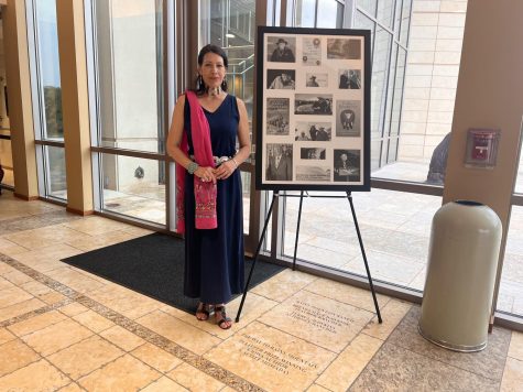 Jill Momaday stands next to a poster honoring her father, Pulitzer Prize-winning Kiowa author N. Scott Momaday, and adjacent to the engraved floor stone near the entrance of the Oklahoma History Center. (Gaylord News Photo/Katie Hallum)
