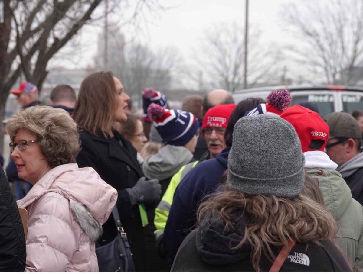 Donald Trump supporters talk amongst themselves as they wait for the doors to open at a campaign rally in Newton, Iowa on January 6th, 2024. Gaylord News/Kevin Eagleson