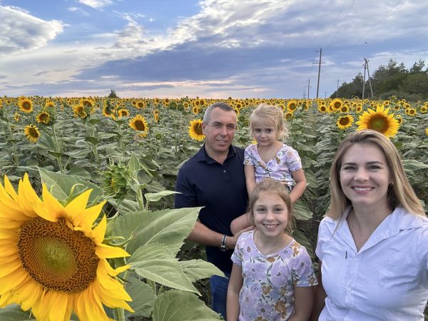 Iurie, Samantha, Evelina and Kelsey, with Moldova sunflowers. (Photo courtesy of Kelsey Walters)