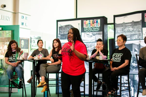Tiffany Crutcher introduces a group of Japanese-American panelists at the Black Wall Street Legacy Summit. Maria Nairn/Gaylord News