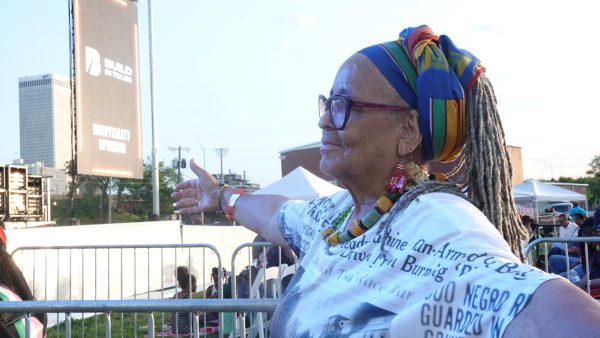 Joyce Smith-Williams celebrates the legacy of Greenwood’s Black Wall Street at the Legacy Festival. Smith-Williams, a longtime Greenwood resident, wears shirts to memorialize the experience of her people almost every day. PHOTO: Madeline Cantrell. 