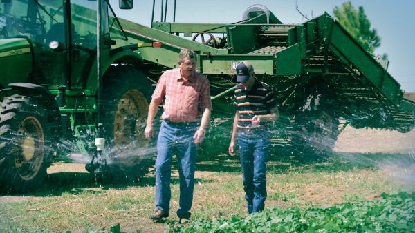 Rep. Frank Lucas (R-Cheyenne) talks with a fellow farmer on a farm in Oklahoma. Photo provided by Frank Lucas