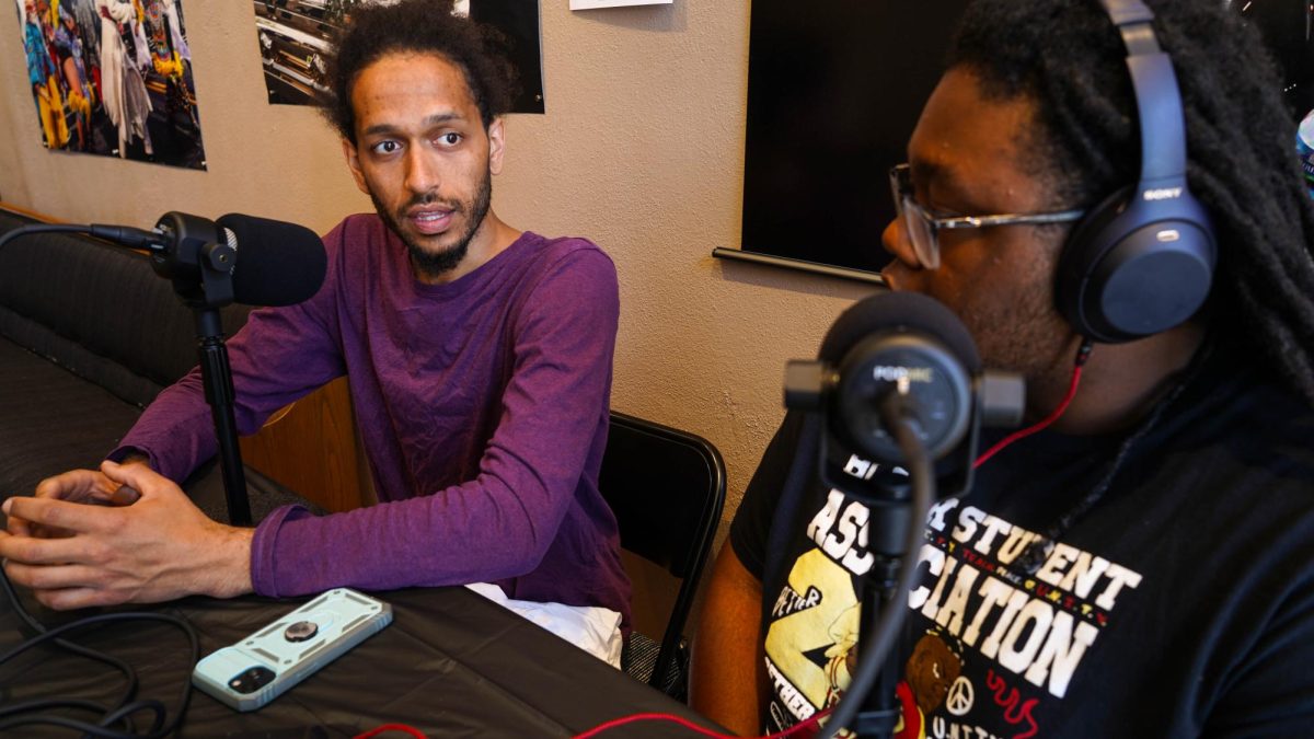 Jordan Powell-Karis speaking to Gaylord News podcast host LJ Golston on the anniversary of George Floyd Square. PHOTO: Julie Jones