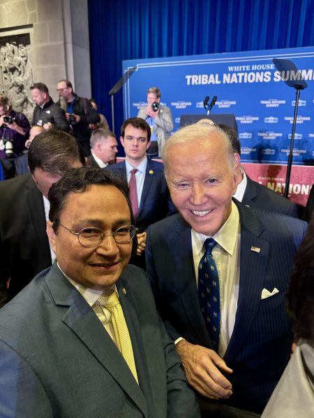 Cherokee Nation Chief Chuck Hoskin Jr. takes a photo with President Joe Biden at the 2024 White House Tribal Nations Summit. During the summit, Biden announced a 10-year plan for Native American language revitalization.