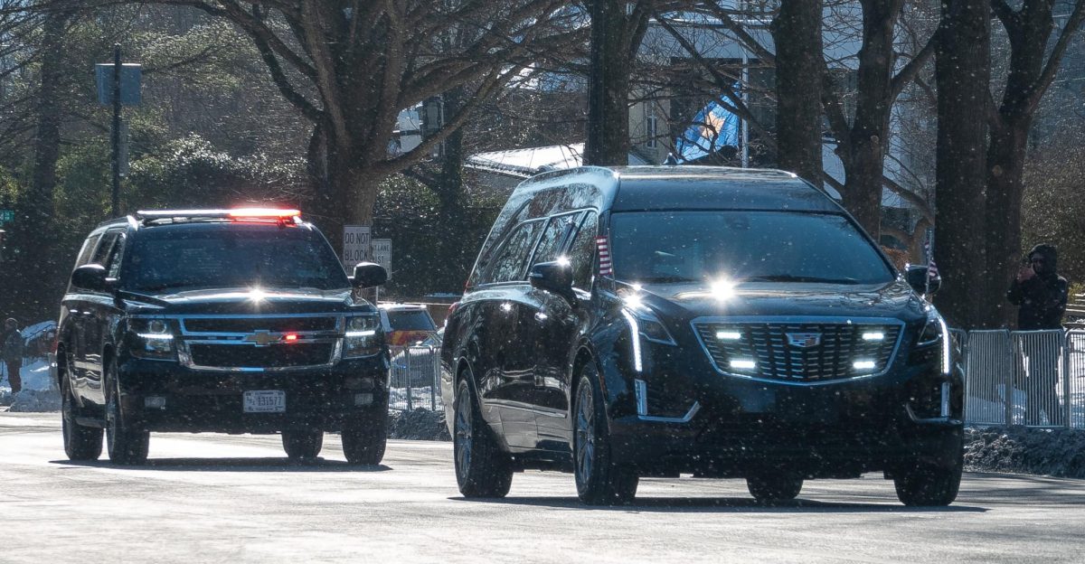 The hearse carrying the casket of 39th U.S. President Jimmy Carter drives down Massachusetts Avenue in Georgetown on its way to the National Cathedral for a state funeral attended by all five living presidents. Kevin Eagleson/Gaylord News 