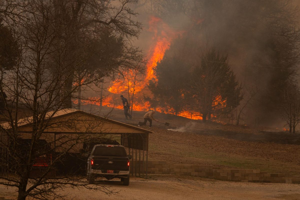 Civilians help respond to a wildfire near 108th Ave in Norman. Photo by Michael Buchanan.