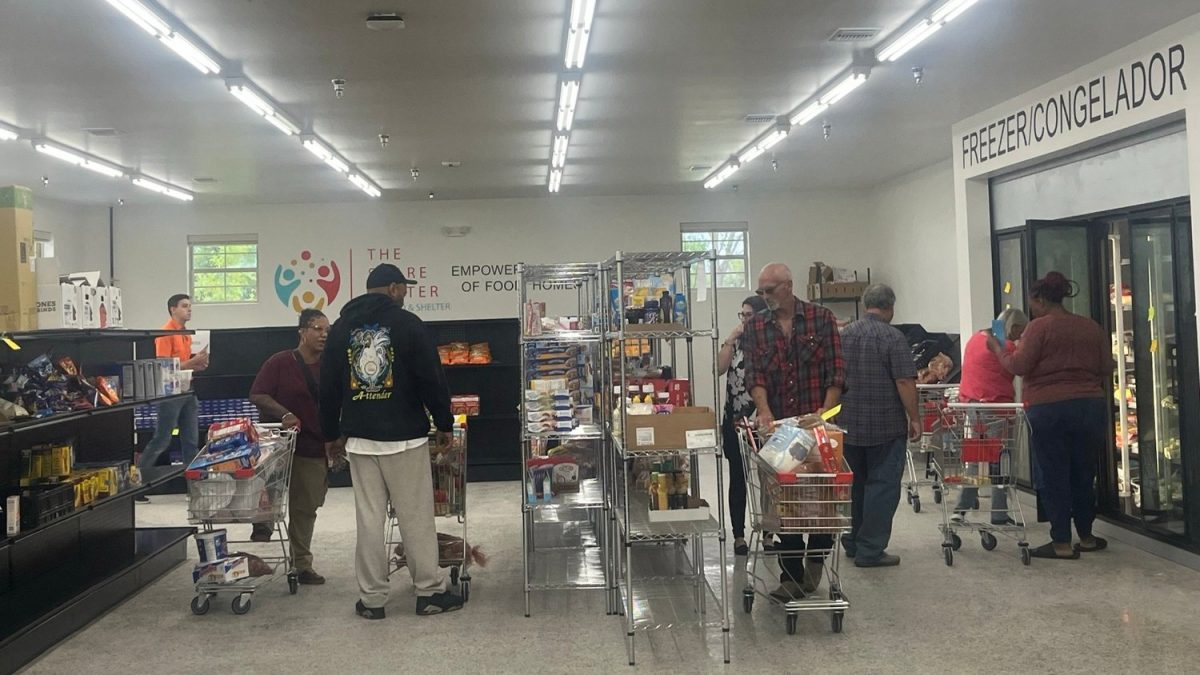 People shop at the Share Center food pantry at Food & Shelter Inc. in Norman.  Photo/Food & Pantry Inc.