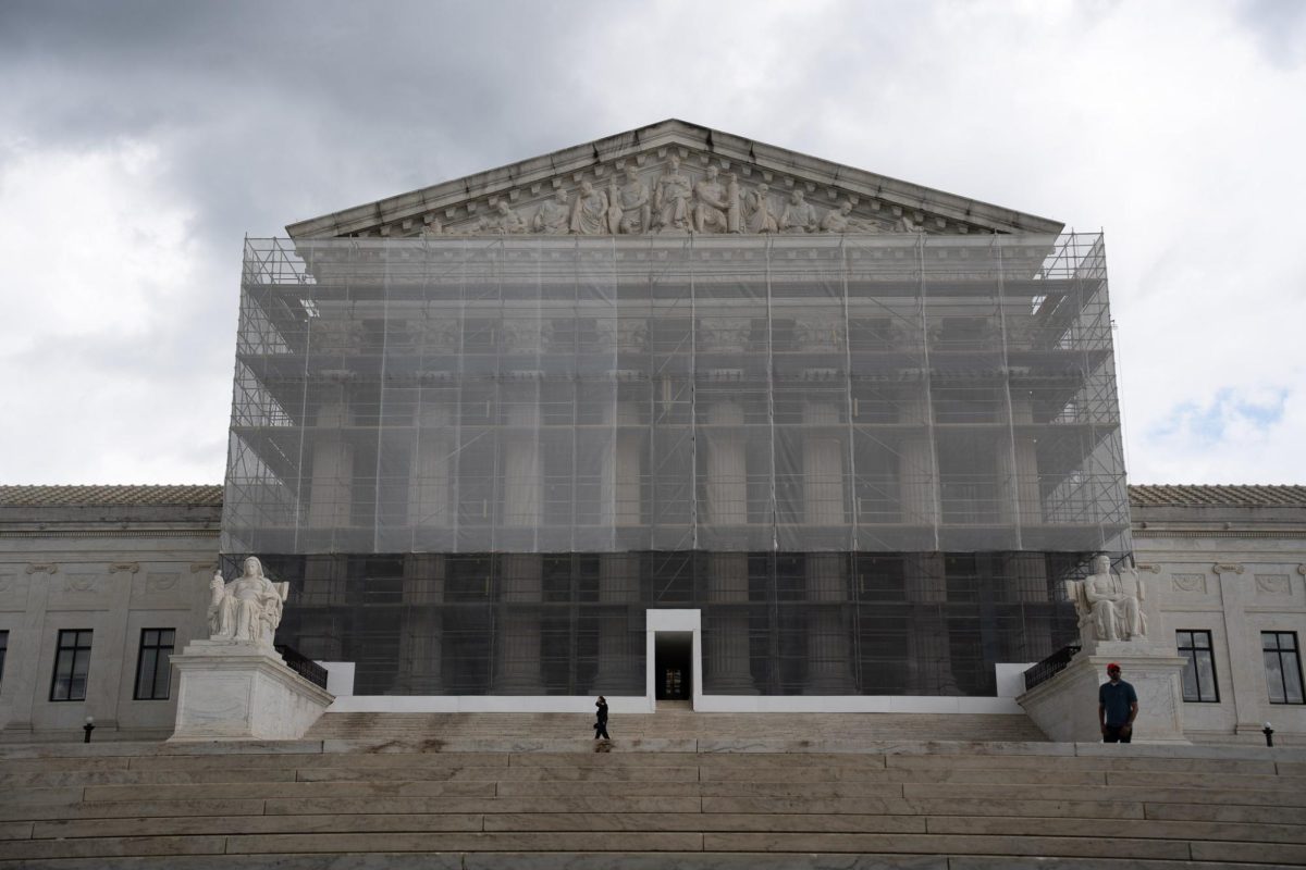 U.S. Supreme Court building in Washington shrouded in construction netting. 