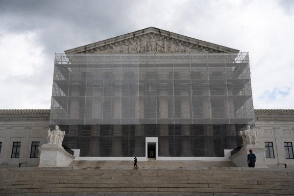 U.S. Supreme Court building in Washington shrouded in construction netting. 