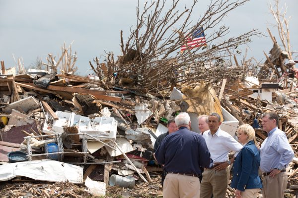 President Barack Obama speaks with FEMA Administrator Craig Fugate (back to camera) and from left Moore Mayor Glenn Lewis, Gov. Mary Fallin and Rep. Tom Cole on May 26, 2013, after EF-5 tornado devastated the city. /Official White House Photo by Pete Souza 
