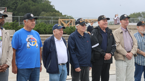 Cherokee veterans honored at the 13th Warrior Flight listen as they are introduced. (Taylor Ann Barnes / Gaylord News) 
