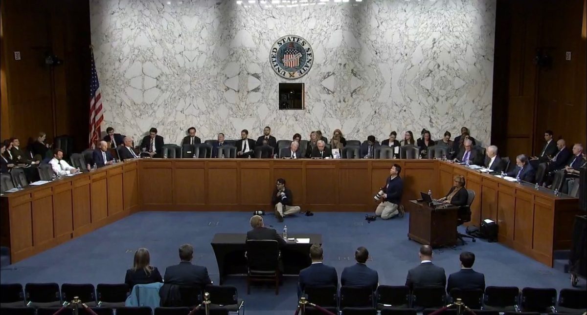 Senate Armed Services Committee hearing, Sen. Markwayne Mullin pictured far on left in white shirt. / Senate Armed Services Committee screenshot
